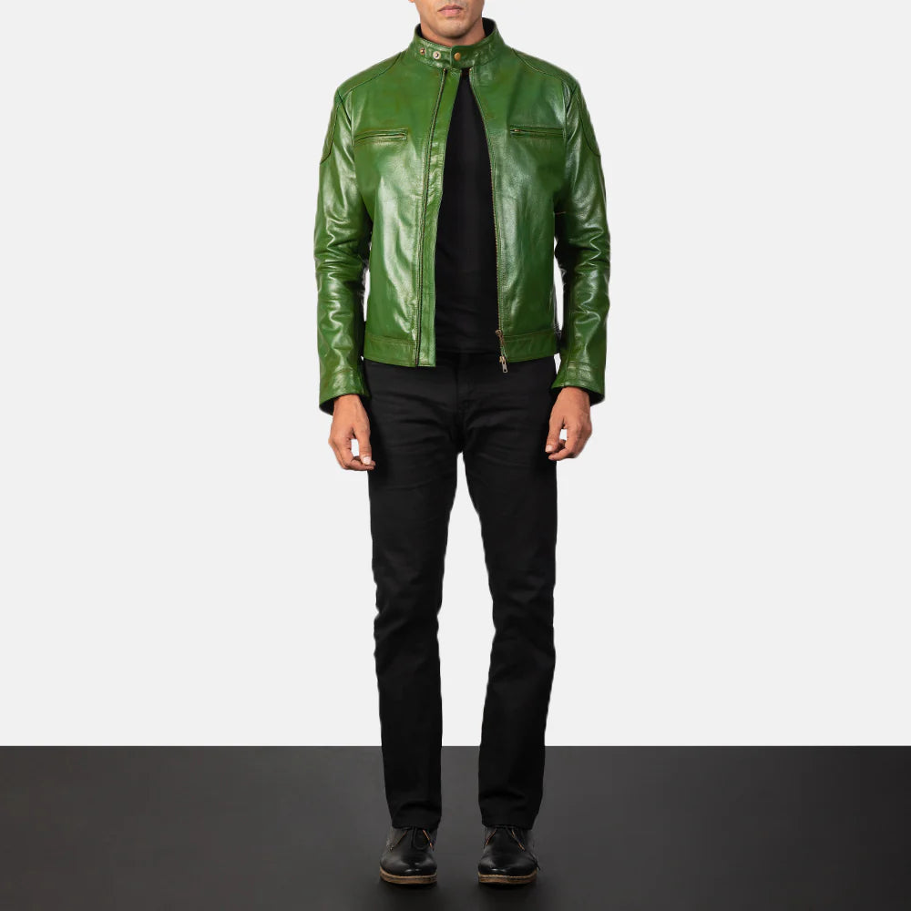 A man wearing the vintage green leather biker jacket as part of a stylish casual outfit.
