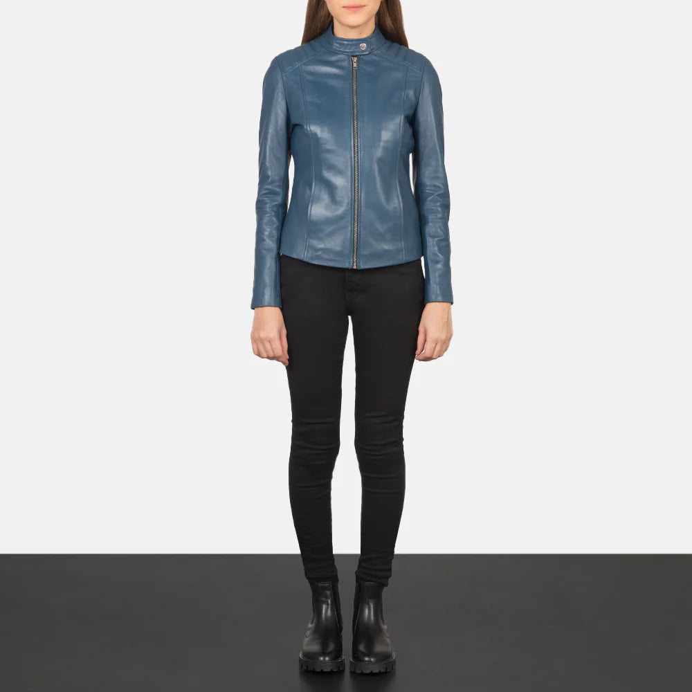 Woman wearing blue leather biker jacket with stylish outfit
